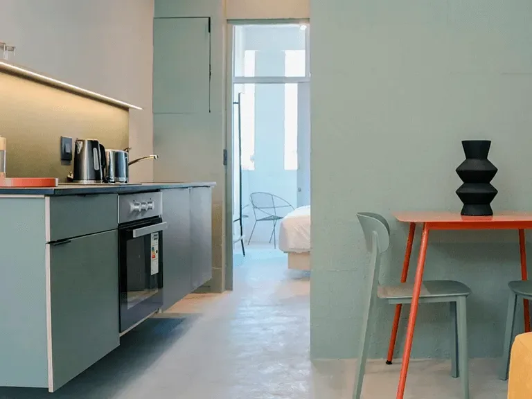 Apartment dining area and kitchen at BlackBrick Gardens