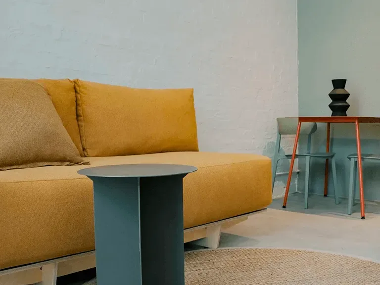 Sofa and dining table at BlackBrick Gardens